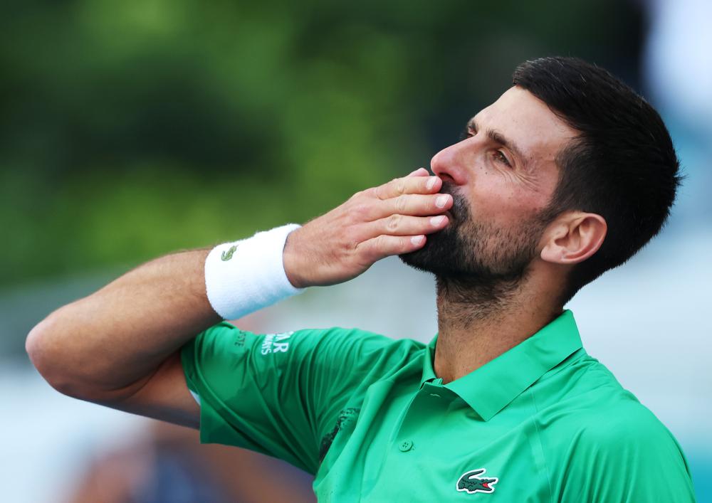 被球迷询问是否会考虑加盟阿森纳，库尼亚大笑回应